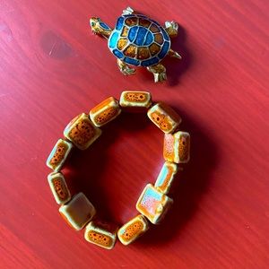 Square orange clay bead bracelet with matching turtle gold orange and blue pin